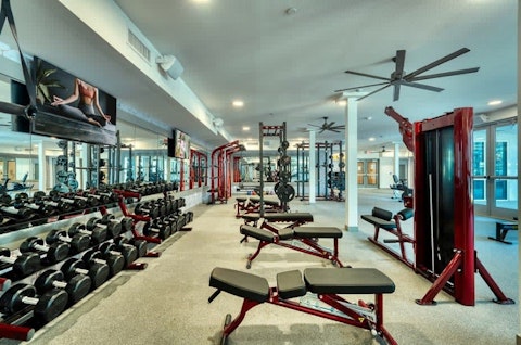 Lift weights in a full-scale gym steps from your door