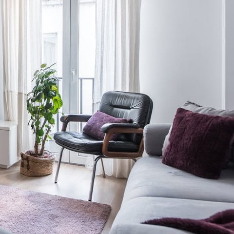 Watch city life unfold below from the Juliet balconies in the living room