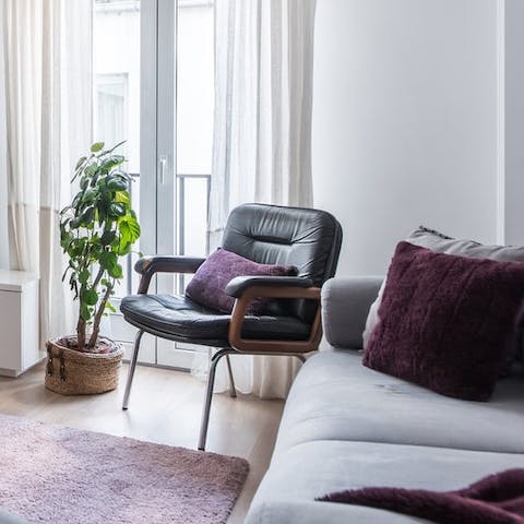 Watch city life unfold below from the Juliet balconies in the living room