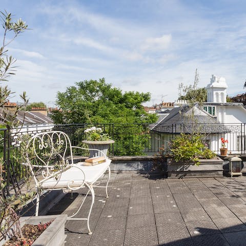 Enjoy your morning coffee on the sunny rooftop terrace