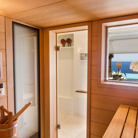 Soothe away any aches and pains in the sauna with sea views