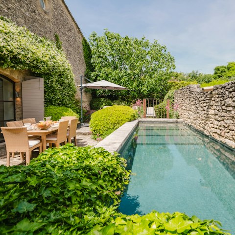 Have a glass of Provence rosé wine next to the private pool