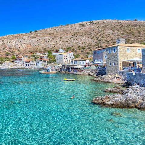 Dip your toes in the crystal clear water of the Mani Peninsula