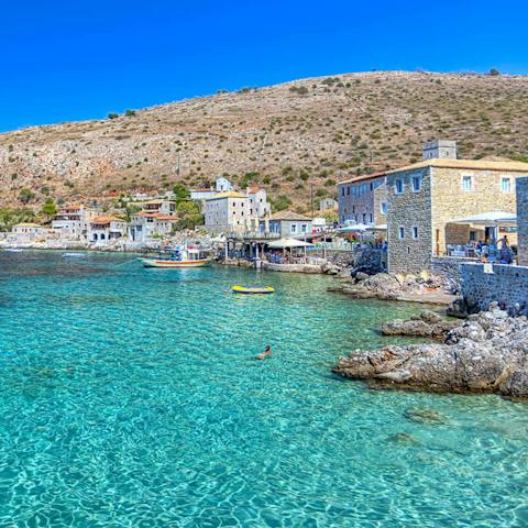 Dip your toes in the crystal clear water of the Mani Peninsula