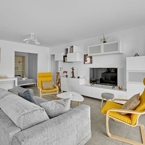 Chill out in the stylish living area with a glass of wine after a day of exploring