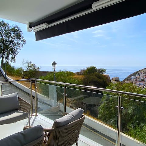 Drink in the sea views from the private balcony over a glass of wine