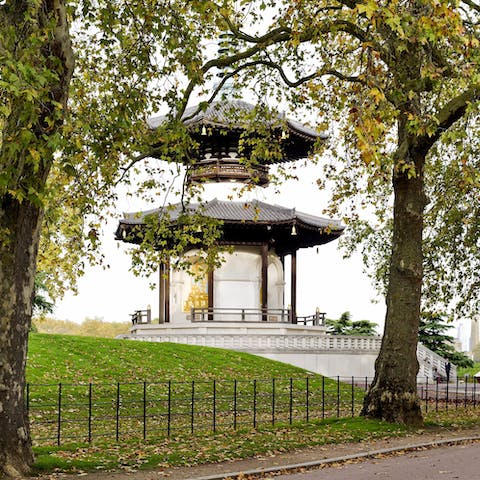 Enjoy a riverside stroll through the greenery of Battersea Park