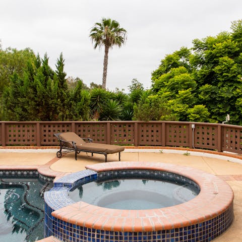 Soak in the hot tub as the sun sets