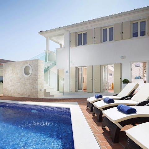Spend blissful days lounging by the private pool
