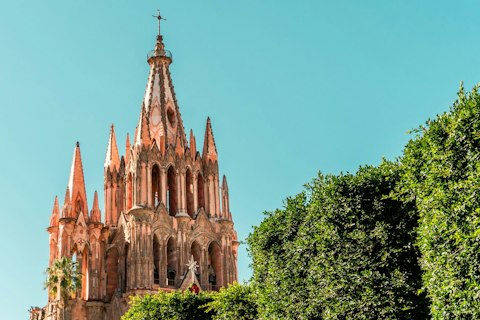 Walk to San Miguel's iconic neo-Gothic pink stone parish church