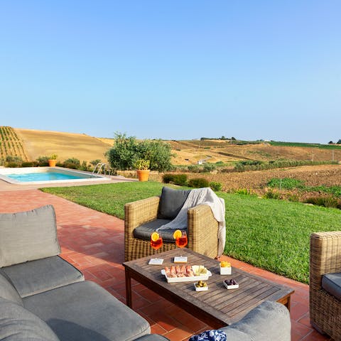 Savour an aperitif, nibbling on antipasti, while taking in the marvellous sunset views from the best seat in the house