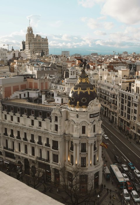 Stroll down the bustling Gran Vía, fifteen minutes by metro