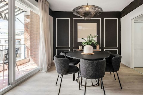 Dine beneath dramatic dark walls with terrace access