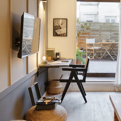 Catch up on work at the desk while listening to some tunes on the record player