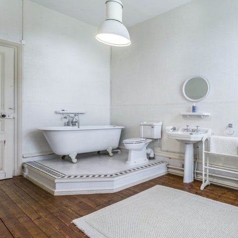 Take a well-deserved soak in the freestanding bathtub