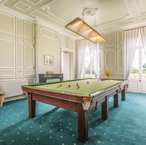 Show off your cue skills on the grand billiards table