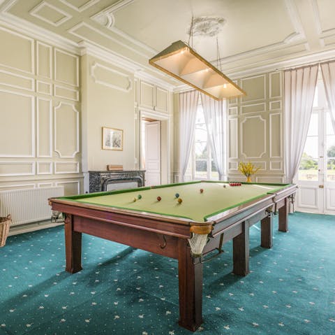 Show off your cue skills on the grand billiards table