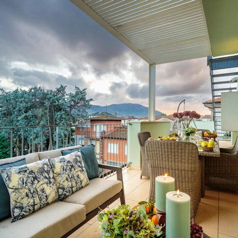Unwind on your private terrace with city views