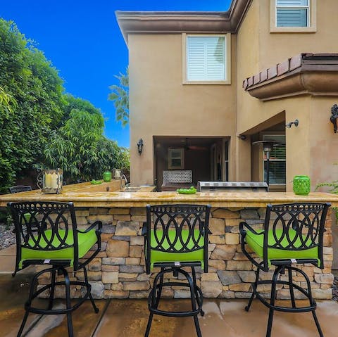 Sip your drinks by the bar in style