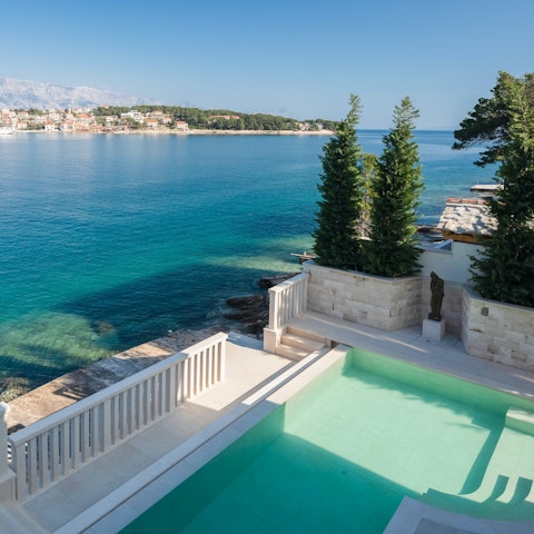 Cool off in the pool while gazing out across the bay