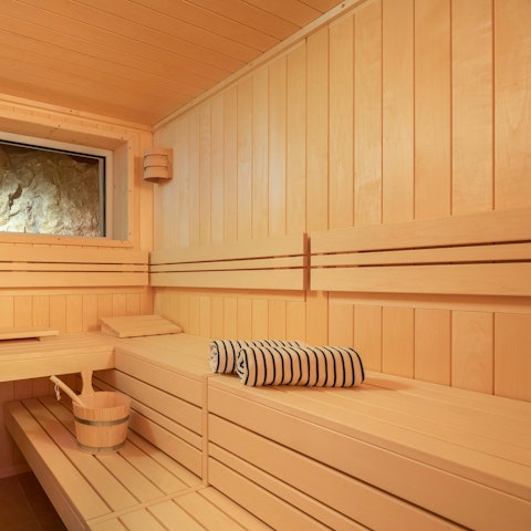 Unwind body and mind in the private sauna