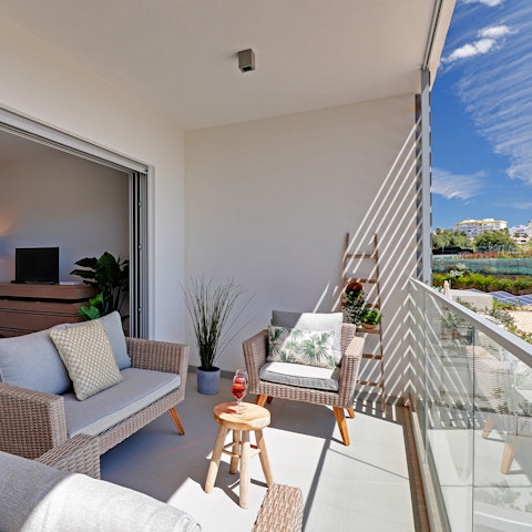 Relax and enjoy a cool drink in the warm sunshine of your private balcony