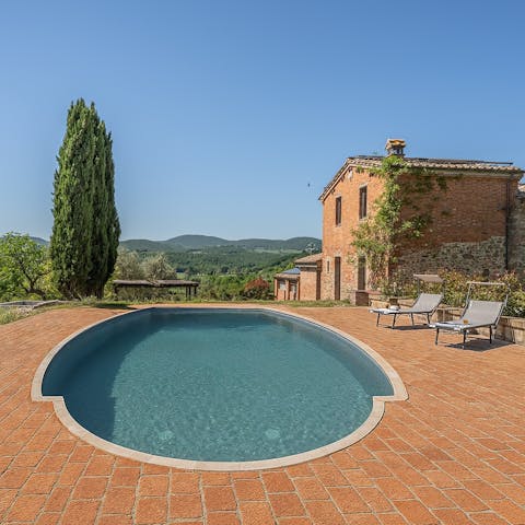 Sprawl out by the communal pool in the sunshine