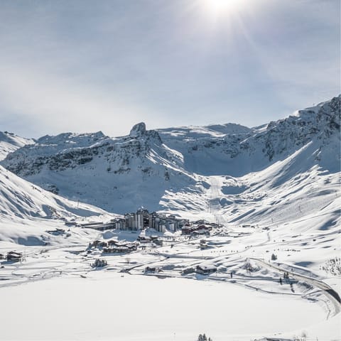 Bask in the sun filled valley sheltered by the Alps