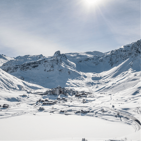 Bask in the sun filled valley sheltered by the Alps