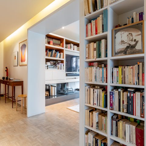 Scour the packed bookshelves to find something you'd been meaning to read