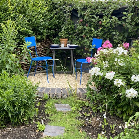 Relax in the private garden surrounded by flowers and fruits