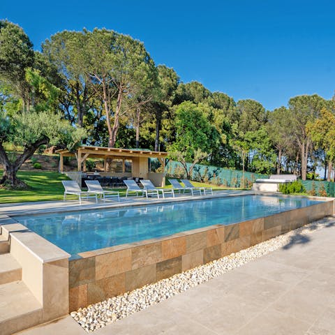 Stretch out by the pool with views of the rolling countryside