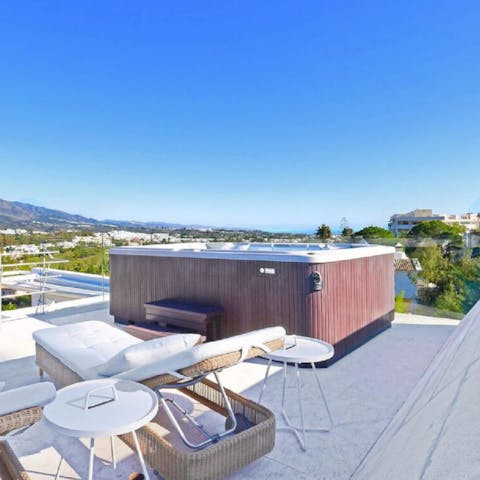 Hop into the jacuzzi and admire the views across the valley