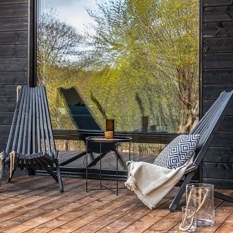 Sip a cup of coffee on the private wooded porch