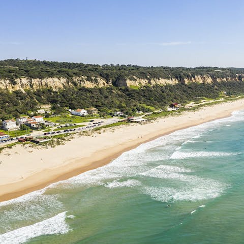 Catch some waves at Praia Fonte da Telha