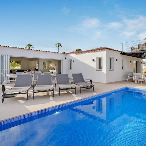 Work on your tan before taking a dip in the private pool