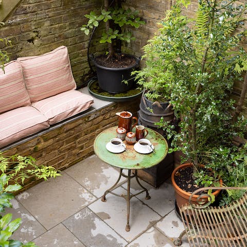 Savour your morning coffee in the secluded garden lounge