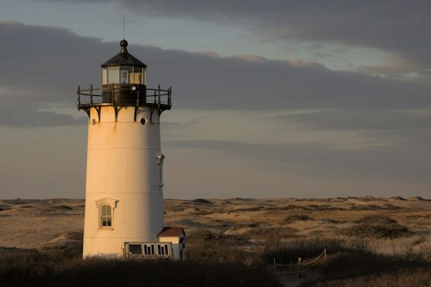 Admire Cape Cod's classic lighthouse-framed shoreline and surf