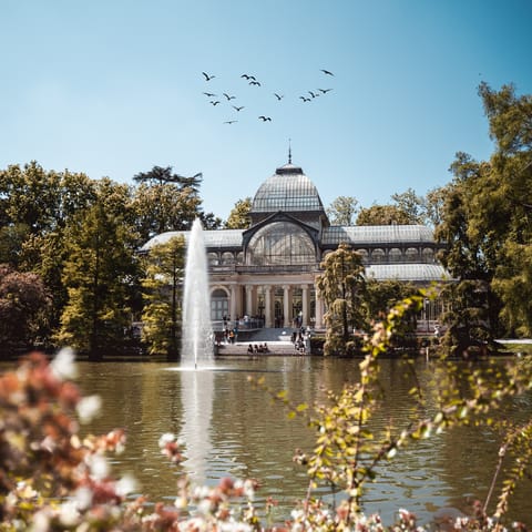 Take a stroll around El Retiro Park, a three-minute walk away