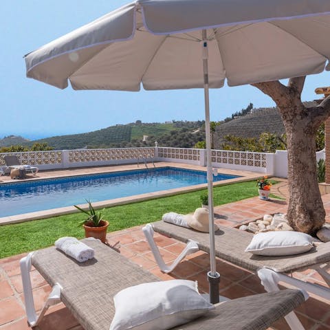 Have a cocktail and a siesta by the pool