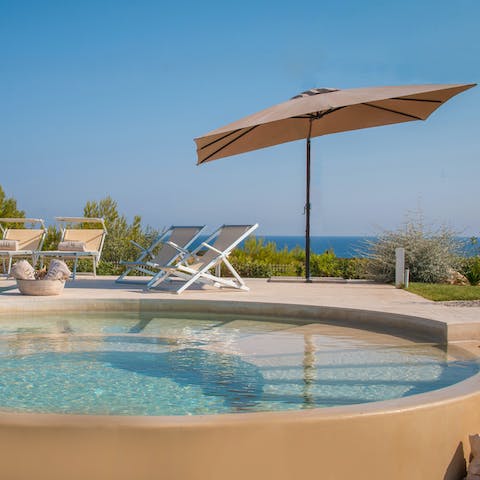 Take a dip in the pool, after sunbathing in the basking sun