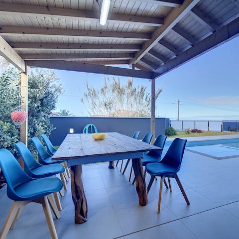 Gather around the alfresco dining area for a sunset barbecue