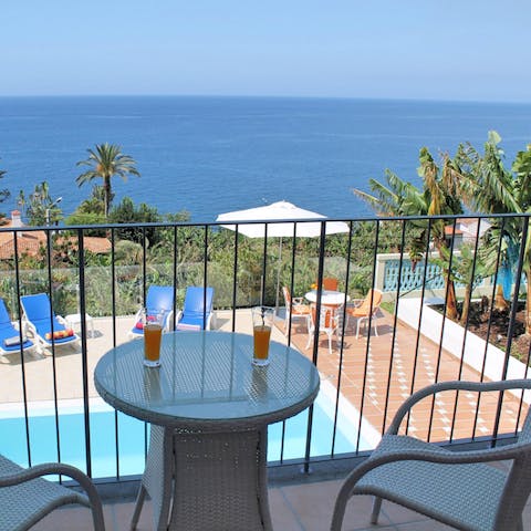 Sit out on one of the bedroom's balconies and savour the beautiful view