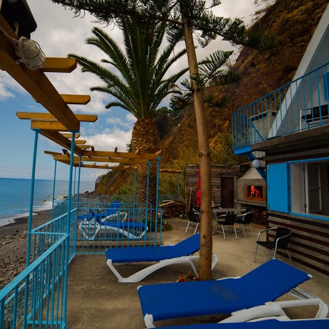 Make the most of the shared rocky beach and hut that lies thirty metres from the front door