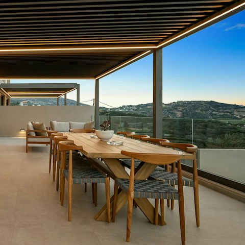 Gather together for dinner with a view at the outdoor dining table