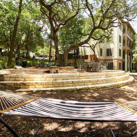 Unwind in the dappled shade with a book in the hammock in the communal garden