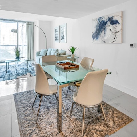 Gather around the table with sweeping city views filling the windows