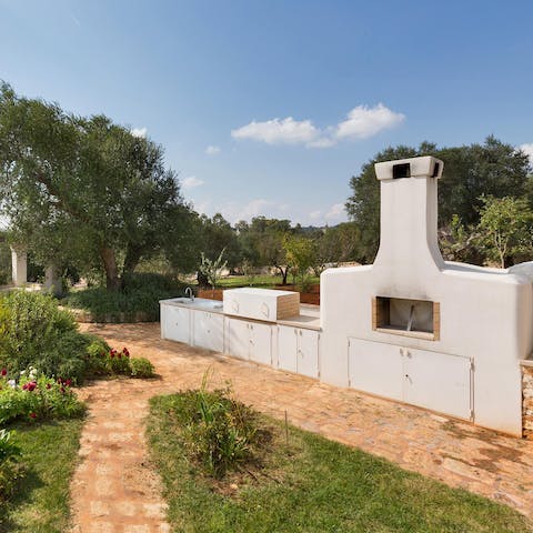 Flex your culinary muscles on the stone barbecue in the garden