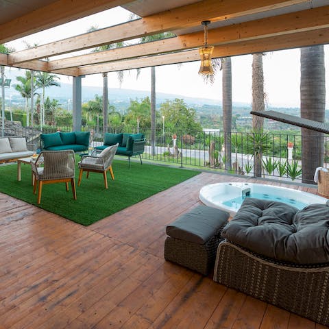Slip into the Jacuzzi on the terrace – it's the perfect spot for a cocktail