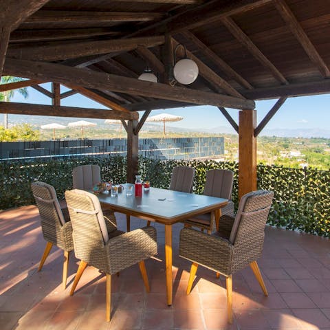 Sip local wine on the upper terrace as the sun is setting